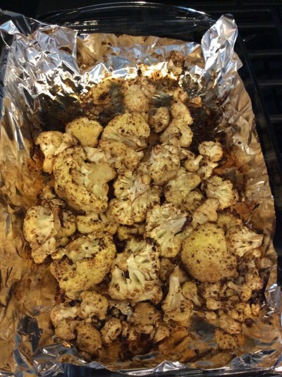 Balsamic roasted cauliflower fresh from the oven. The aluminum foil makes clean up a whole lot easier.